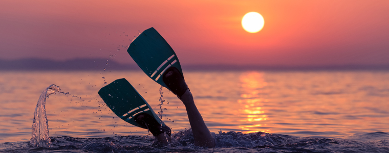snorkel fins hawaii sunset