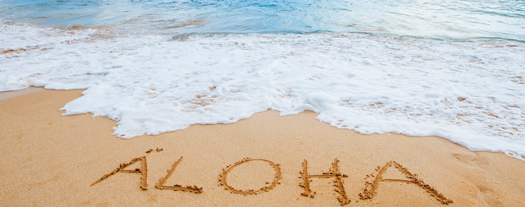 aloha written in sand