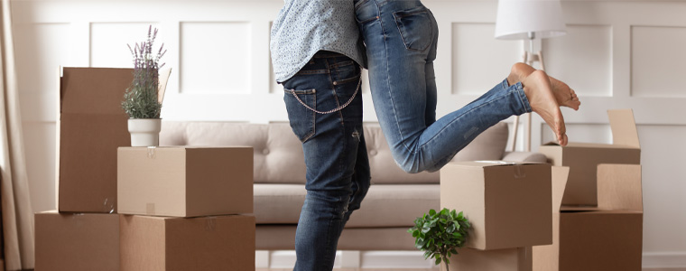 excited couple in new home