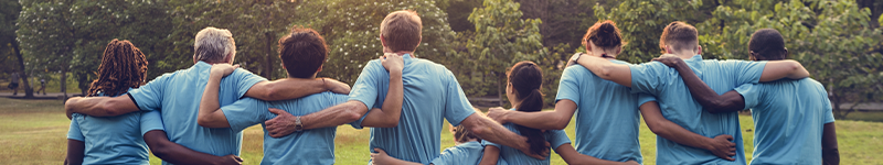 group of volunteers walking in a park